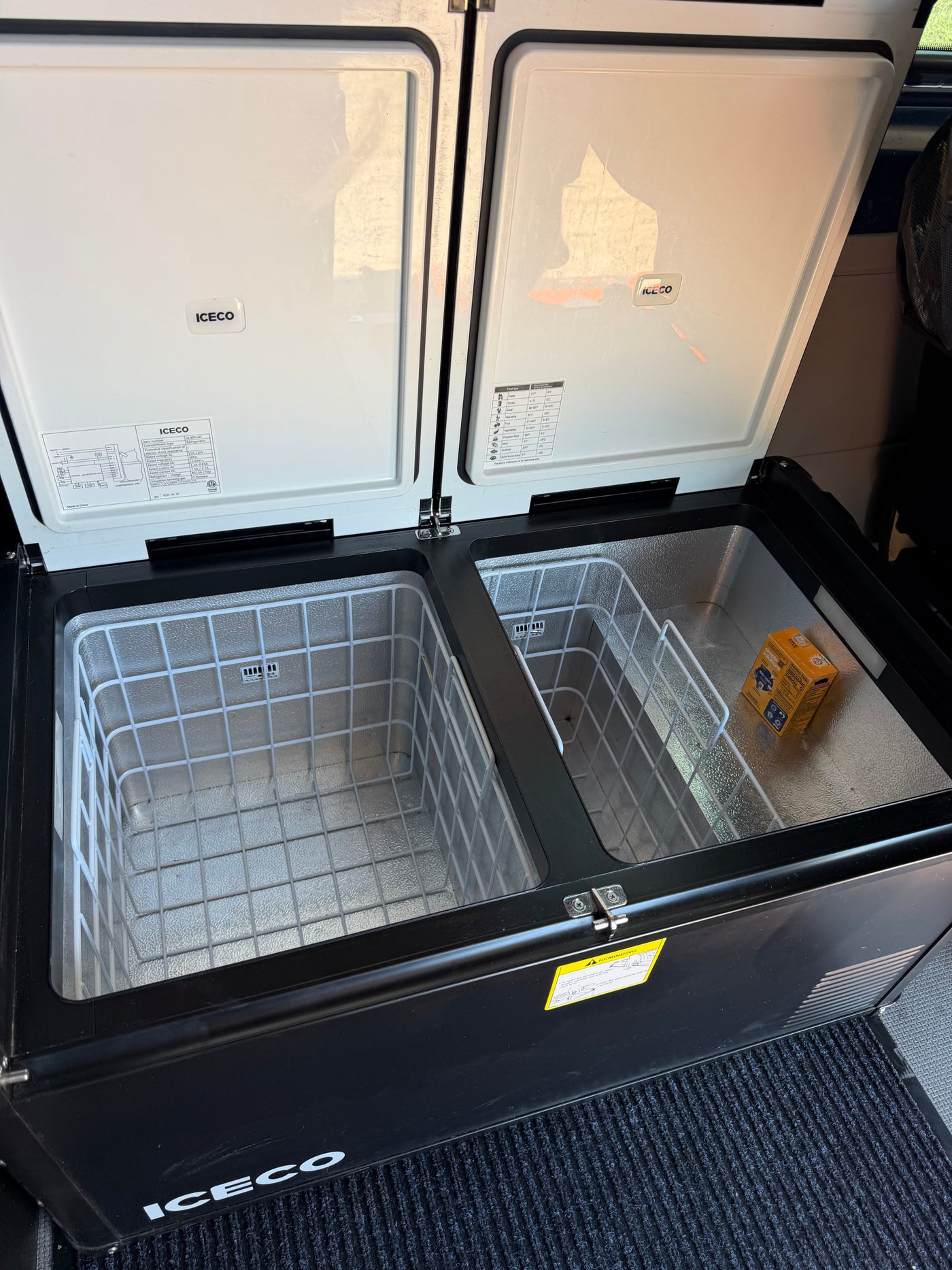 ICECO dual-zone portable fridge/freezer inside an RV rental. Ideal for keeping food fresh while traveling. — photo 12