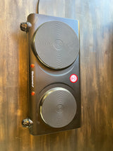 Black Elite Gourmet portable double burner hot plate with control knobs & indicator lights, great for any RV rental kitchen.