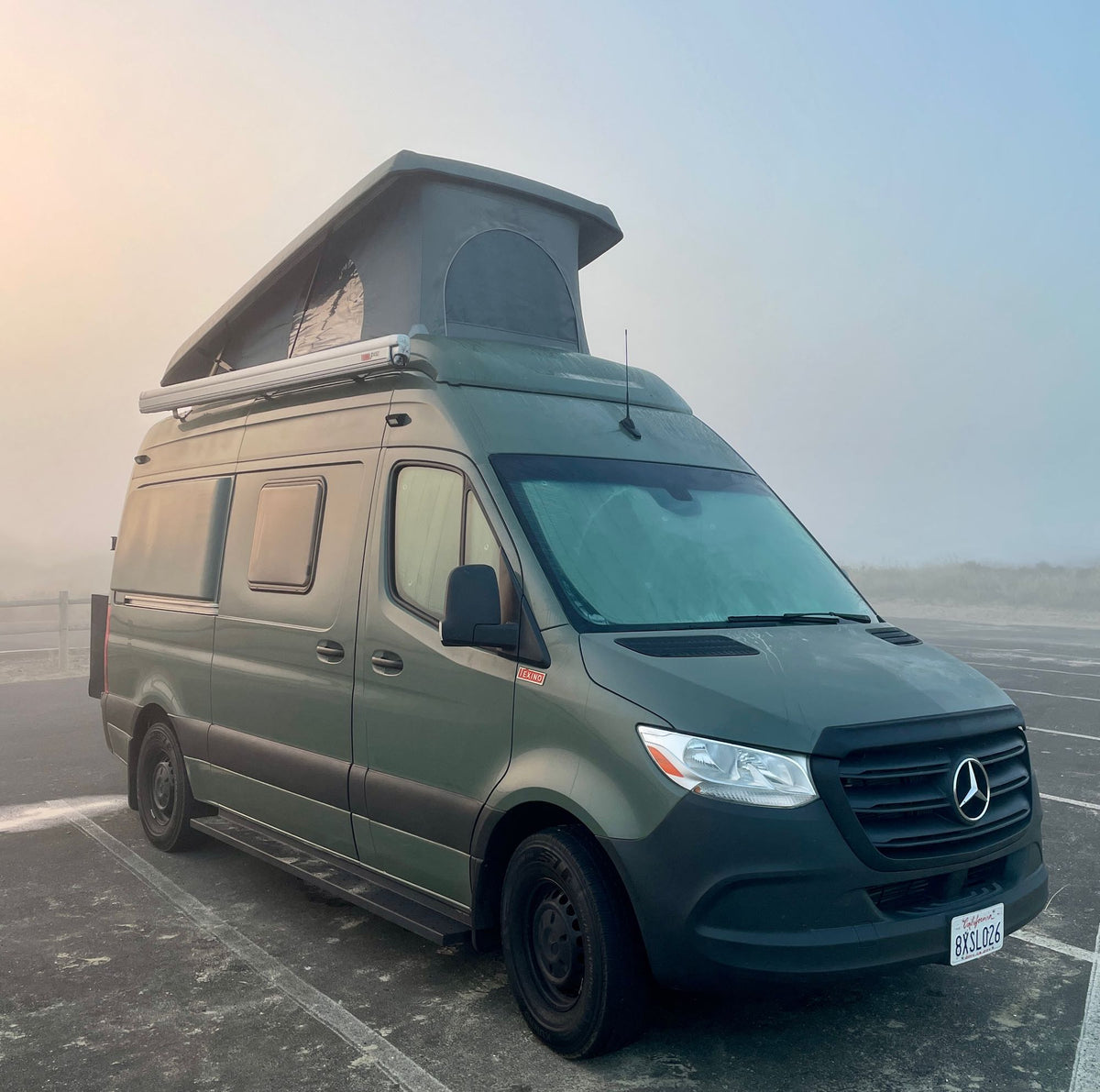 Green Mercedes-Benz Sprinter camper van