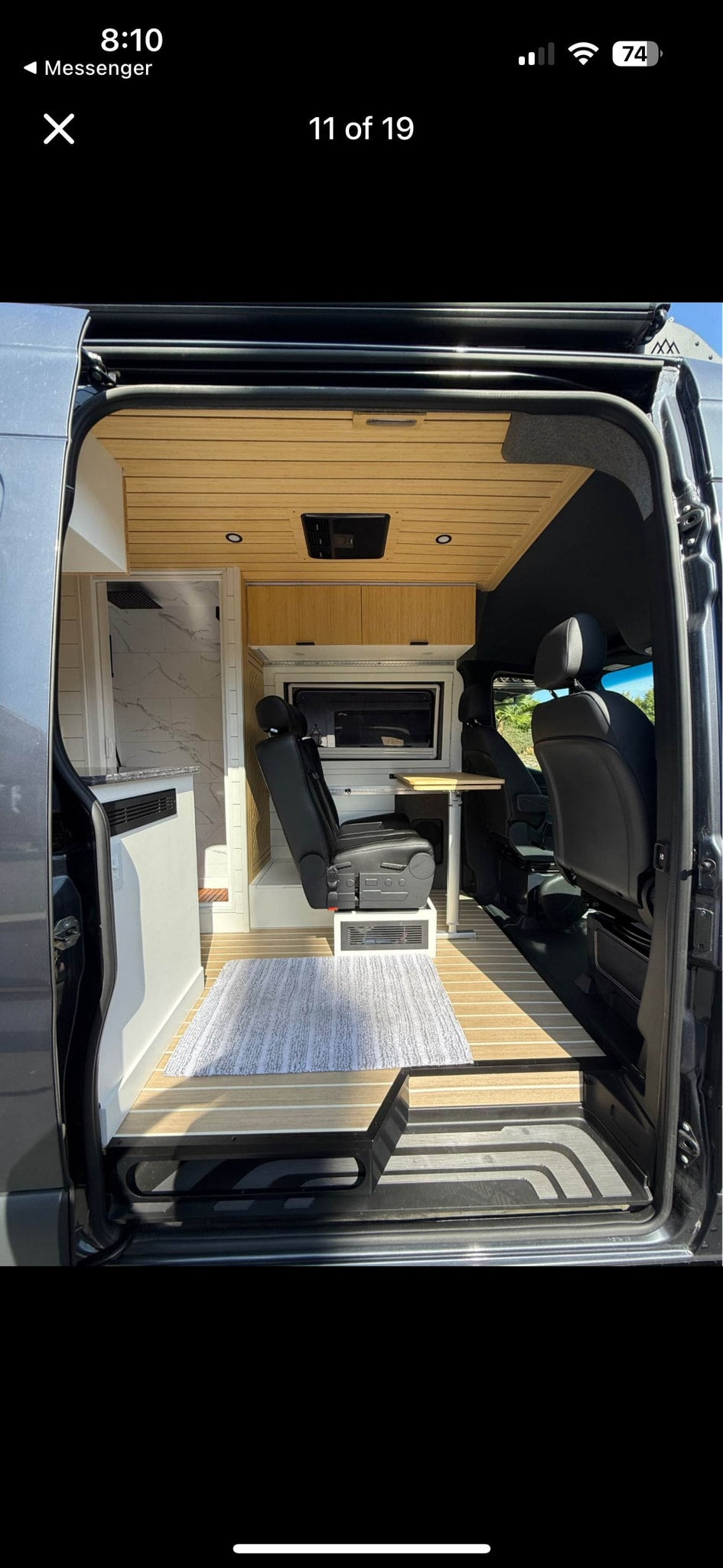  and spacious design for your road trip.|Modern rv rental's spacious interior from open door — photo 7