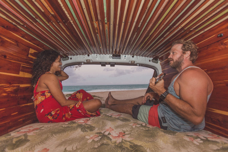  and wood-paneled walls with shelving.|Cozy RV rental interior with a fully equipped kitchenette and a breathtaking beach view. Perfect for your next adventure!|Beachside living: Explore this custom RV rental — photo 10