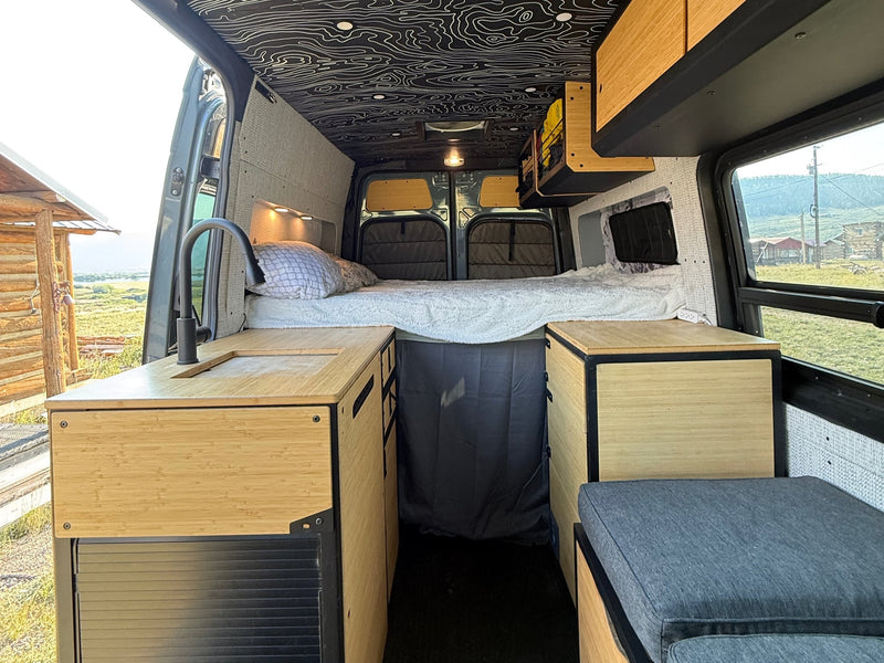  and wood accents.|Modern rv rental van conversion with bamboo kitchen — photo 5