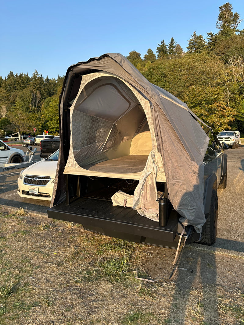 This truck bed tent transforms a pickup into a compact camper for outdoor adventures, a flexible alternative to an RV rental. — photo 12