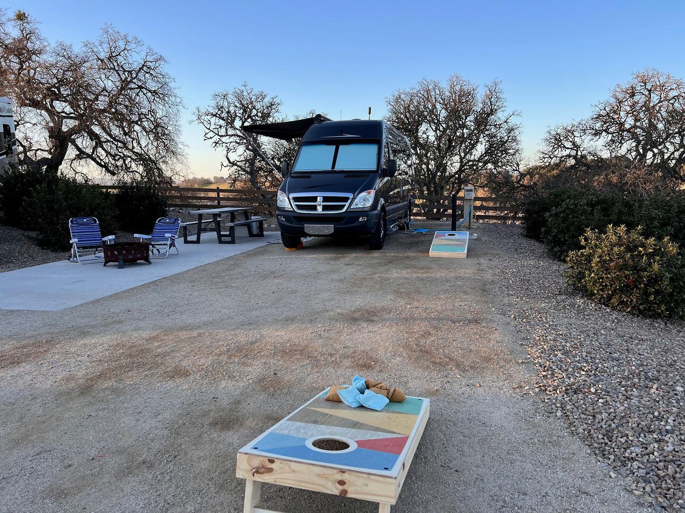  and wooden cabinets. Ideal for comfortable travel.|Spacious RV rental interior looking forward: comfortable front seats — photo 8