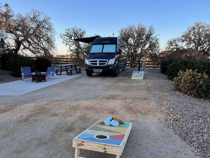  and wooden cabinets. Ideal for comfortable travel.|Spacious RV rental interior looking forward: comfortable front seats — photo 8