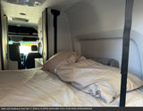 Comfortable RV rental bed and inviting interior cabin view, offering a cozy sleeping area for your next adventure.