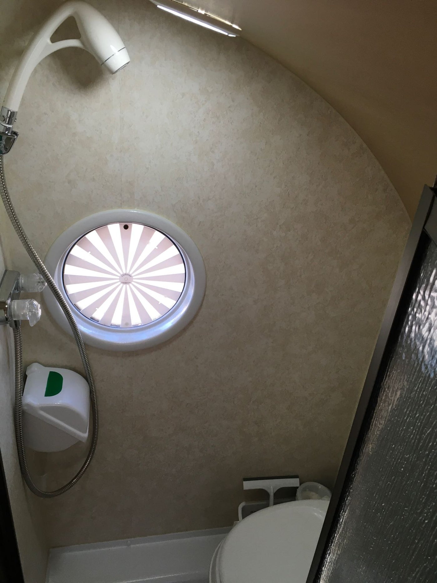  rests among red rock mountains. Ideal for outdoor adventures.|Ready for adventure: A modern gray travel trailer — photo 16