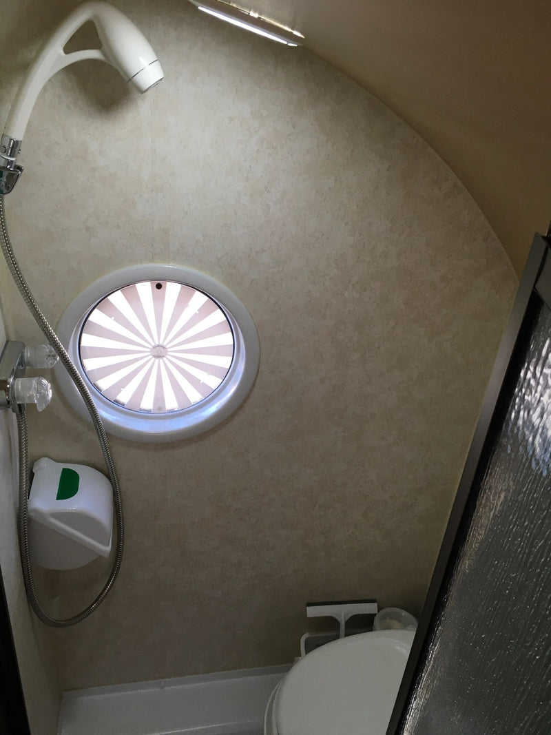  rests among red rock mountains. Ideal for outdoor adventures.|Ready for adventure: A modern gray travel trailer — photo 16