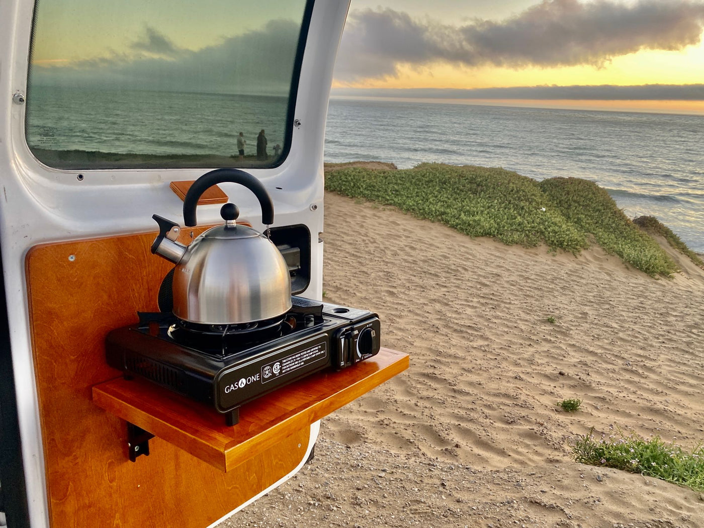  modern camper van interior for your next RV rental adventure. Features bed — photo 10