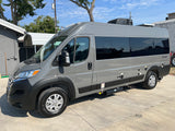 Gray Class B rv rental, a modern camper van, parked outdoors on concrete, perfect for travel adventures.