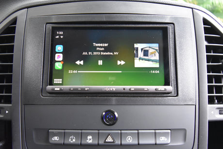 Apple CarPlay on a Sony car stereo plays Phish music in an rv rental, perfect for a road trip adventure.