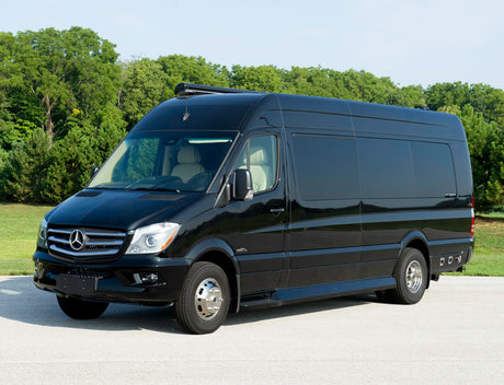 This sleek black Mercedes-Benz Sprinter van, ideal for rv rental, is a luxury camper van ready for travel.