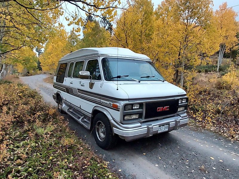  and wooden cabinets for comfortable camper van adventures.|RV rental dashboard: 179033 miles — photo 14