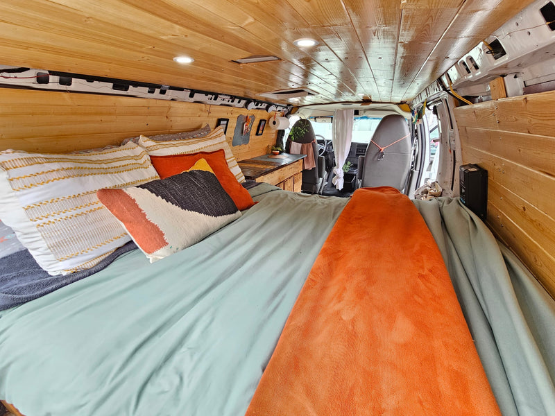  and smart storage solutions for adventurous road trips.|RV rental interior shows grey seats — photo 4