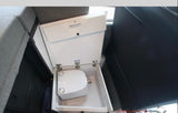 Hidden portable toilet inside a space-saving pull-out compartment, a convenient feature for an RV rental.
