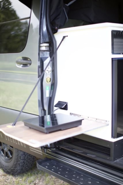  and ventilation for a comfortable campervan adventure.|Explore the comfortable interior of this camper van RV rental — photo 14