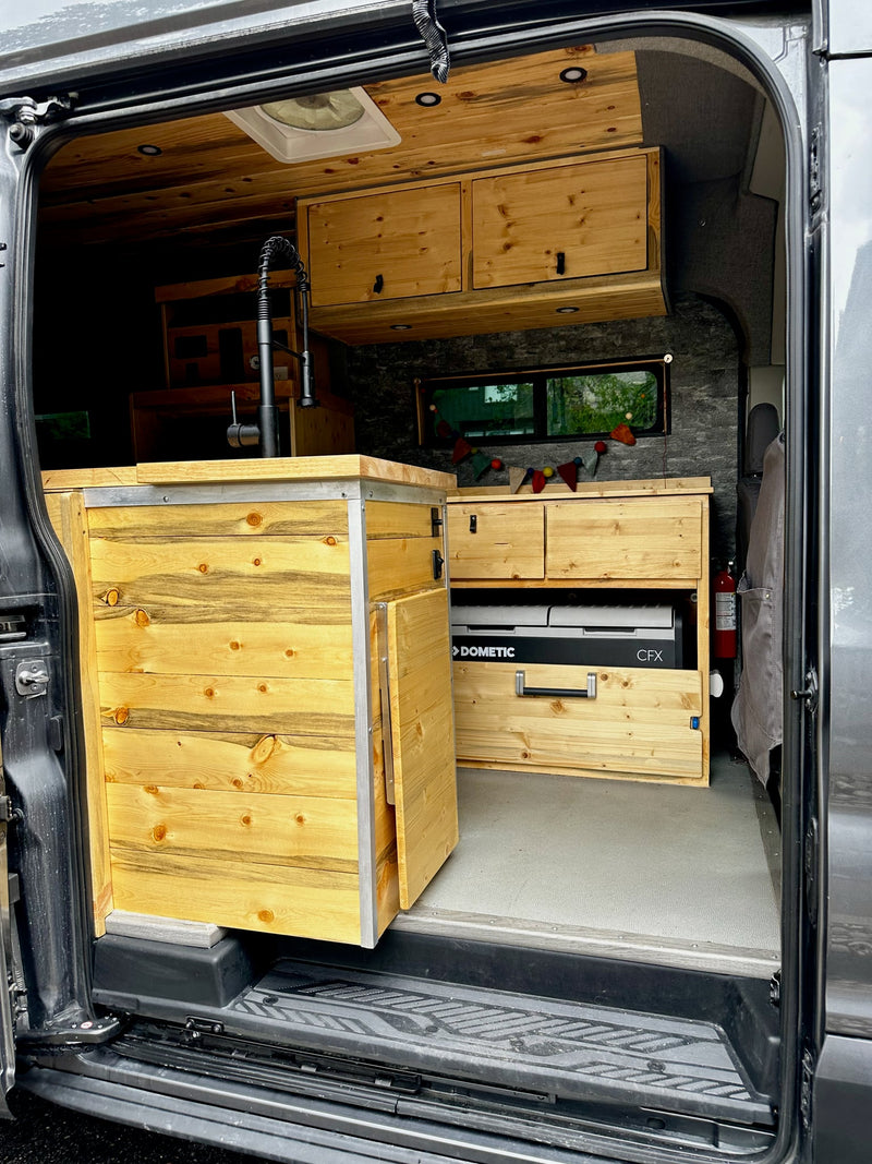  ideal for van life travels.|Detailed view of an rv rental's custom wood interior — photo 15