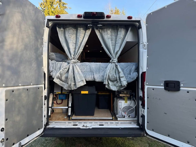  and hidden toilet. Efficient design for travel.|RV rental camper van interior: Swivel seats & dinette table. A cozy setup for meals & work on your adventure.|Cozy RV rental interior: wooden ceiling — photo 6