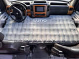 Grey LUNO air mattress fills RV rental's front cabin, turning it into a comfortable sleeping space. Ideal for travel & camping.