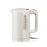 Sleek white Bodum electric kettle, a compact kitchen appliance with water level marks. Ideal for your next RV rental trip!