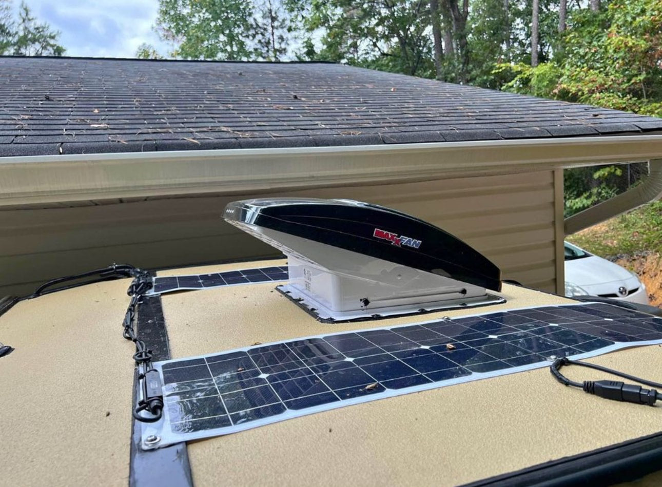 This RV rental roof features a Maxx-Fan vent and flexible solar panels, ideal for off-grid living. — photo 5