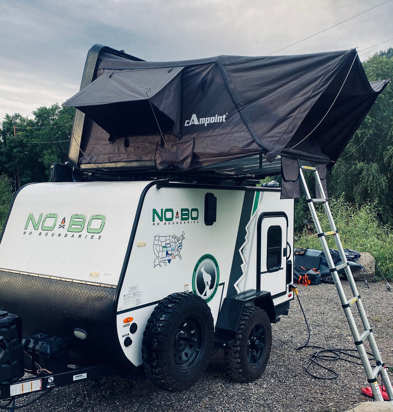 Adventure-ready RV rental: A NO BO travel trailer with a deployed Campoint rooftop tent — photo 1