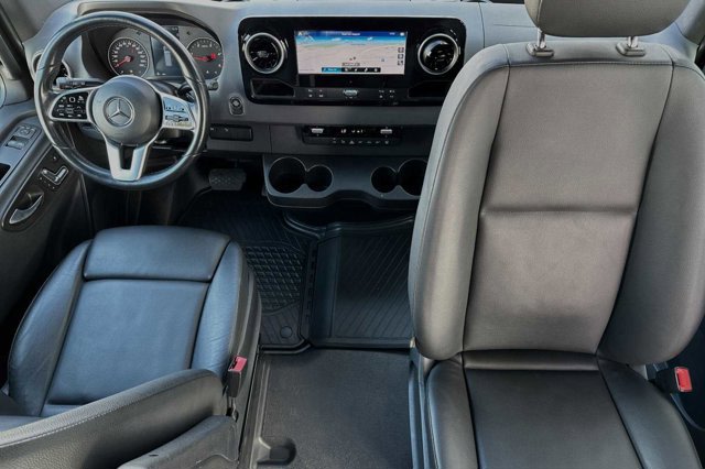  and large rear storage.|RV rental van interior with comfy bed — photo 14