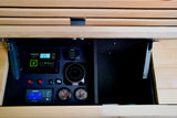 Detailed RV rental control panel showing solar charge, Webasto heater, water levels, and inverter status for off-grid living.