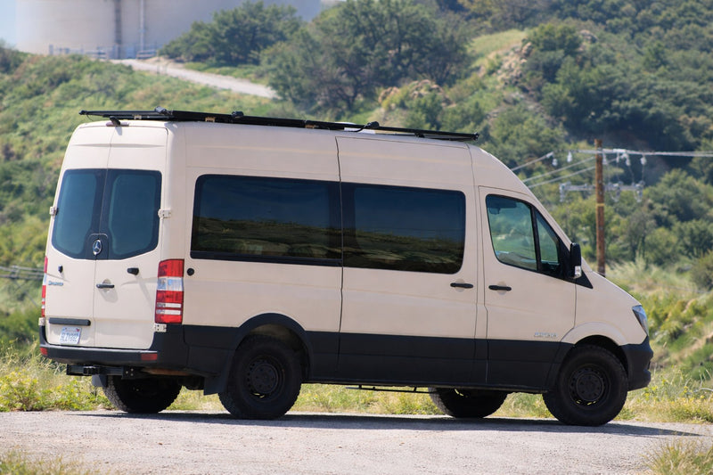  a beige van with off-road tires & roof light bar — photo 2