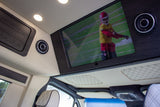 Experience luxury in this RV rental! Custom interior with a large TV, premium sound, and quilted seating for comfort.