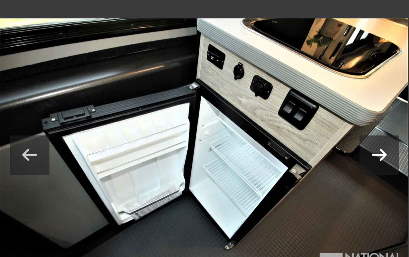  and integrated storage.|This RV rental interior features a compact kitchen with a sink — photo 12