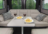 Enjoy a comfortable pasta and wine dinner in your RV rental. This cozy dinette is ideal for relaxing meals on the road.