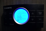 Digital Dometic thermostat in an rv rental set to 66°F, showing auto mode. Essential for RV climate control.