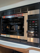 This compact air fry microwave, featuring bake, roast, and convection modes, is perfect for an rv rental kitchen. Includes safety warning.