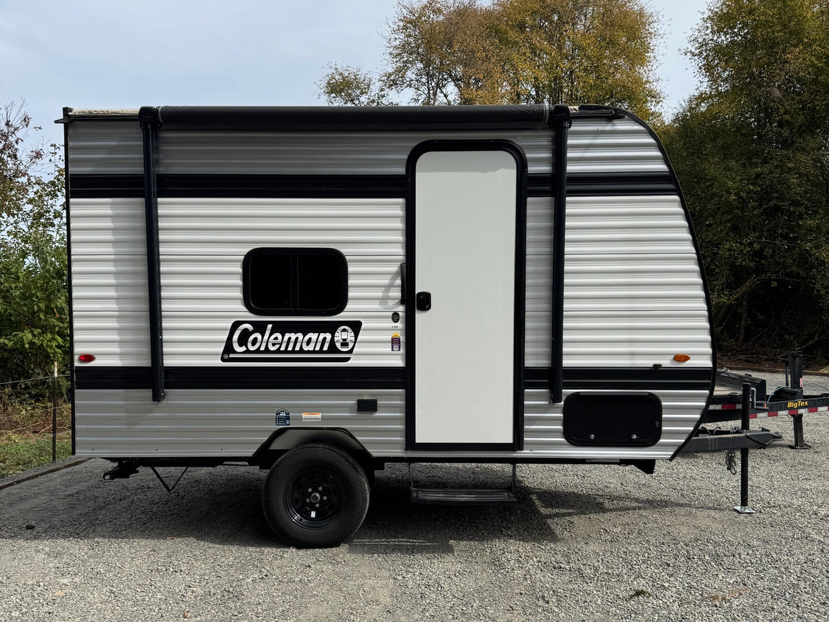 This small Coleman travel trailer RV rental features an awning