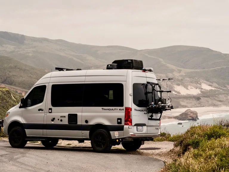 Explore the coast in a silver Tranquility 4x4 rv rental van