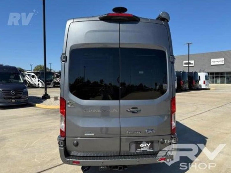  featuring roof-mounted gear & tinted windows.|Modern gray camper van for RV rental — photo 4