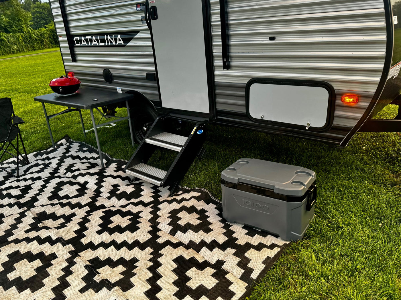  awaiting provisions for a camping trip.|Cozy RV rental bunk beds with "Life is better at the campsite" bedding — photo 15