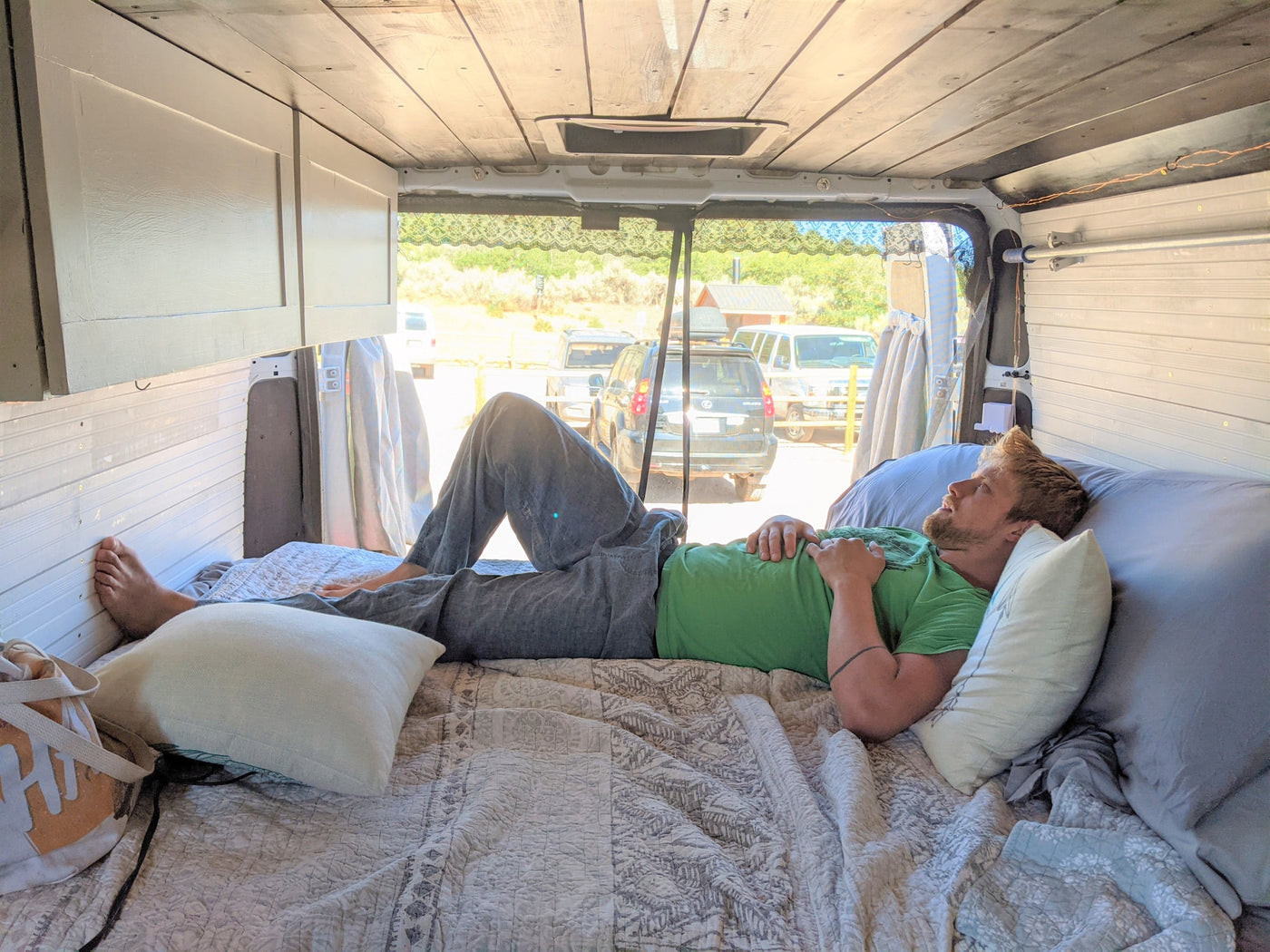  & dining table with two mugs.|Private outdoor shower for your RV rental adventure: patterned curtains — photo 10