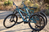 Two Specialized electric mountain bikes on a dirt path, ideal for an RV rental outdoor adventure.
