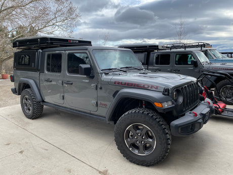 Adventure-ready Jeep Gladiator Rubicon with iKamper rooftop tent, ideal for rv rental and overlanding trips.
