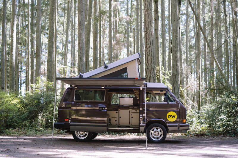 Brown VW camper van with pop-top and awning deployed — photo 1