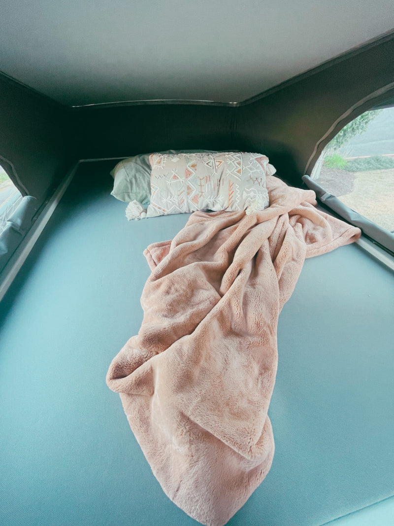  and neatly folded towels.|Cozy rv rental interior: compact kitchen (microwave — photo 10