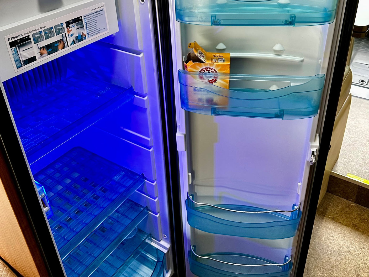  set into a patterned countertop.|This RV rental bathroom features a compact toilet