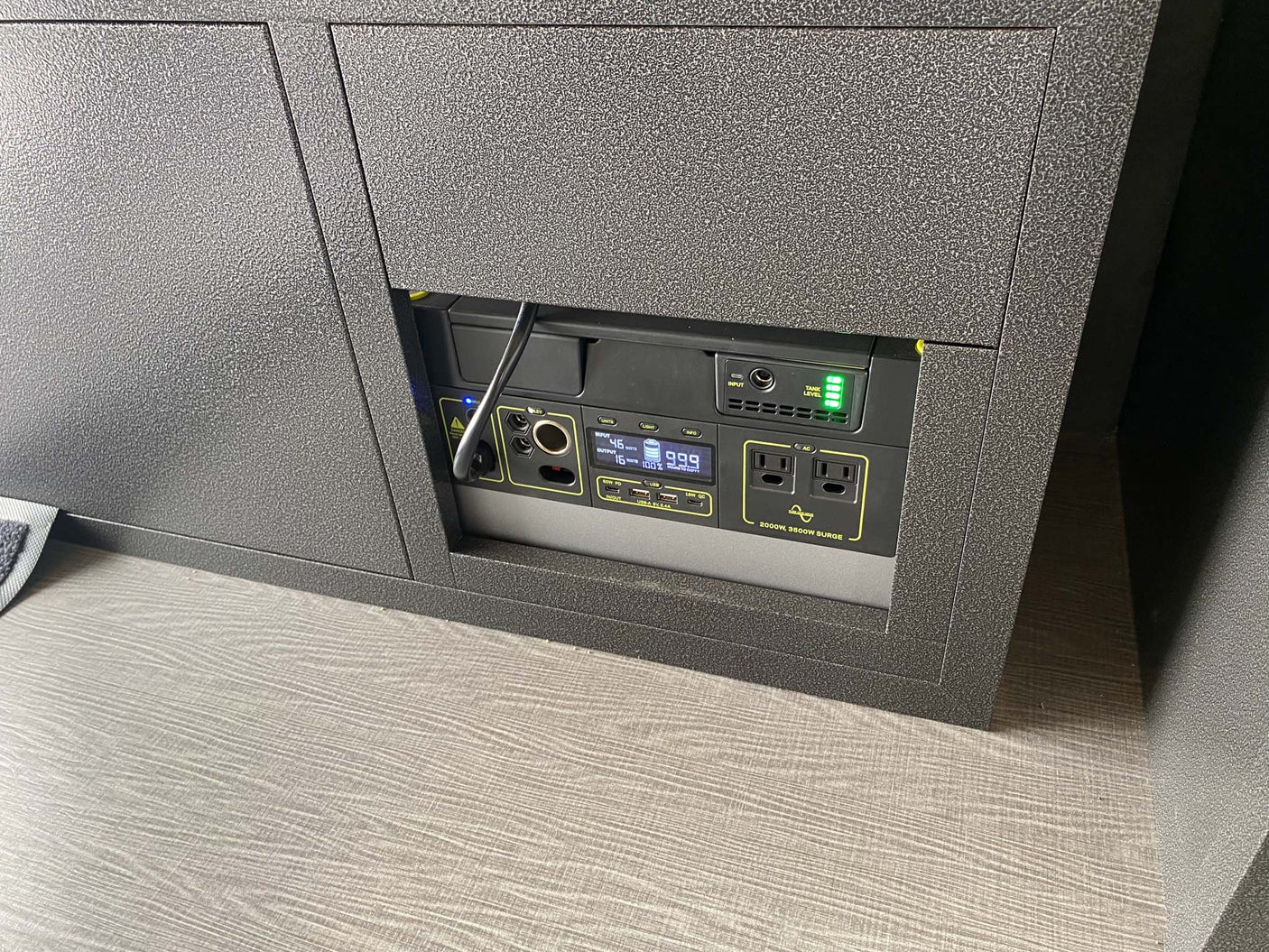 This RV rental features a Goal Zero power station built into the cabinet, showing 100% battery and 99.9 hours runtime.