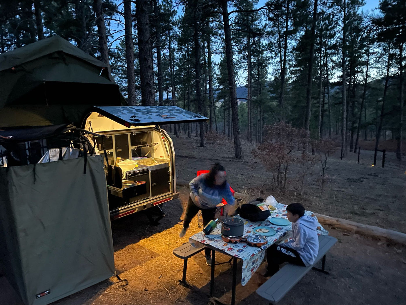  plus storage.|Explore your next rv rental! This camper's side reveals a pull-out storage bay with a secured portable power station.|A portable fridge/power unit secured in an RV rental — photo 13