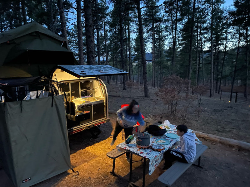  plus storage.|Explore your next rv rental! This camper's side reveals a pull-out storage bay with a secured portable power station.|A portable fridge/power unit secured in an RV rental — photo 13