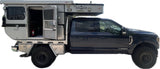 Side view: Ford F-350 pickup with a Hawk Four Wheel Pop-Up Camper. Consider this versatile RV for your next rv rental adventure.