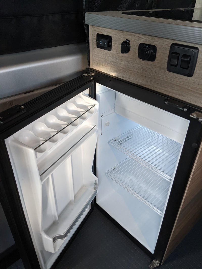  and a comfortable bed. Perfect for mobile adventures.|RV rental: Clever camper van interior featuring a folded bed — photo 15