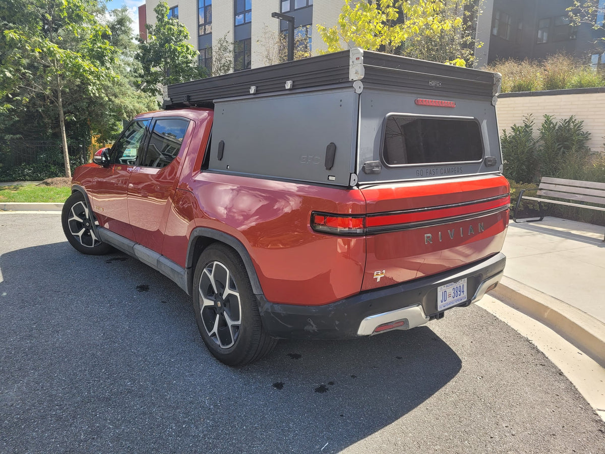  DC.|Red Rivian R1T electric pickup truck with GFC camper — photo 5